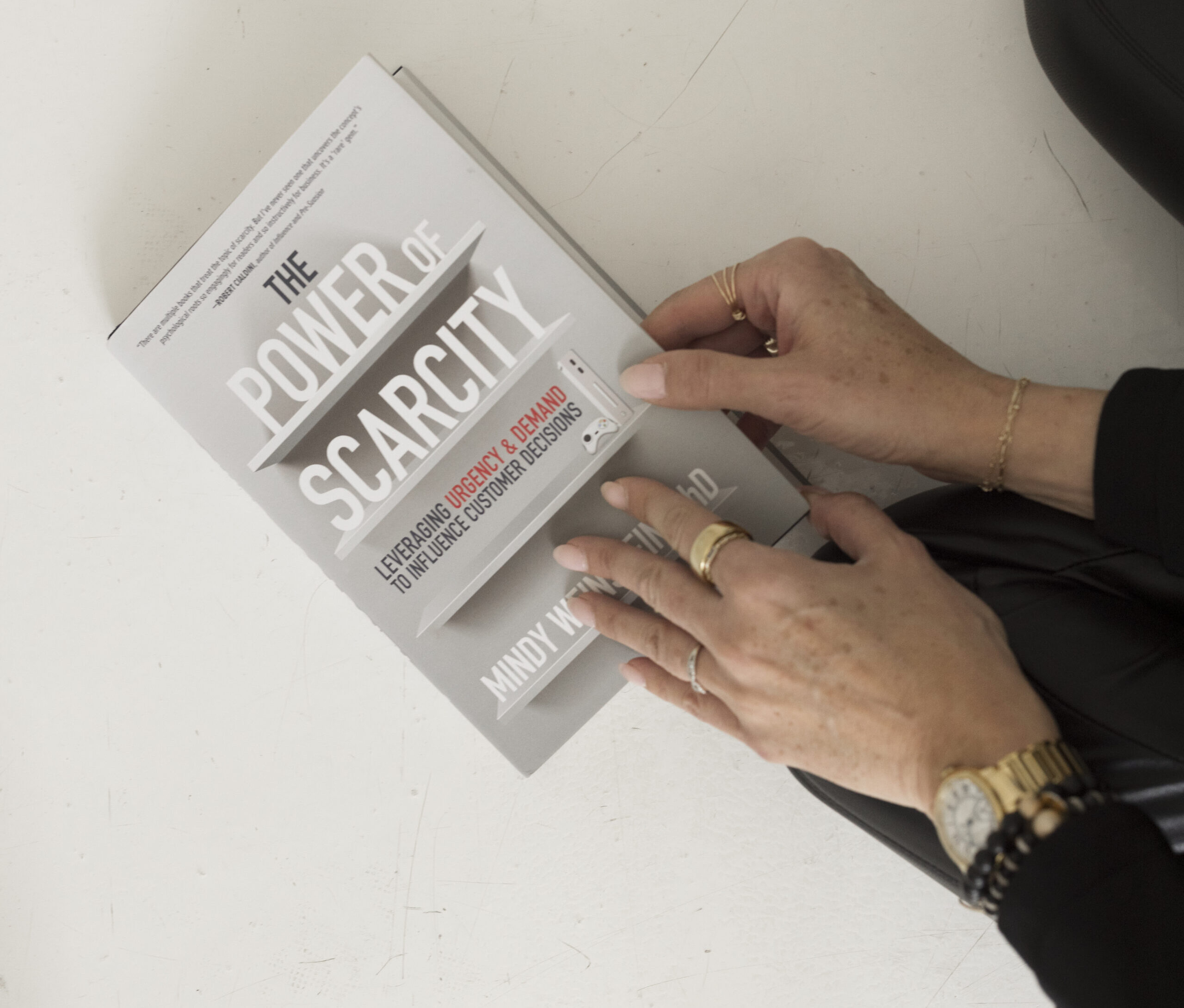 a person opening a book on marketing psychology