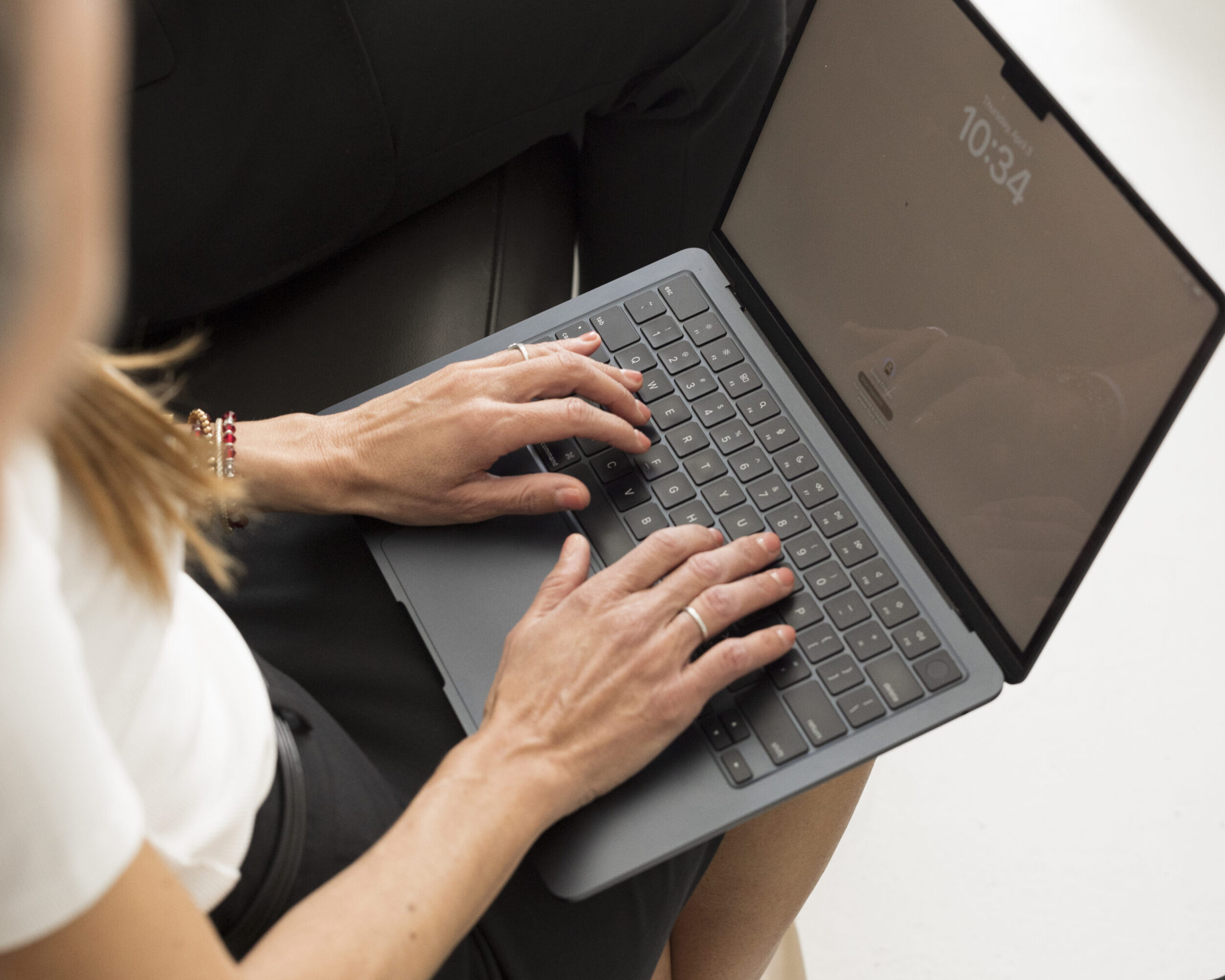 person typing on a laptop