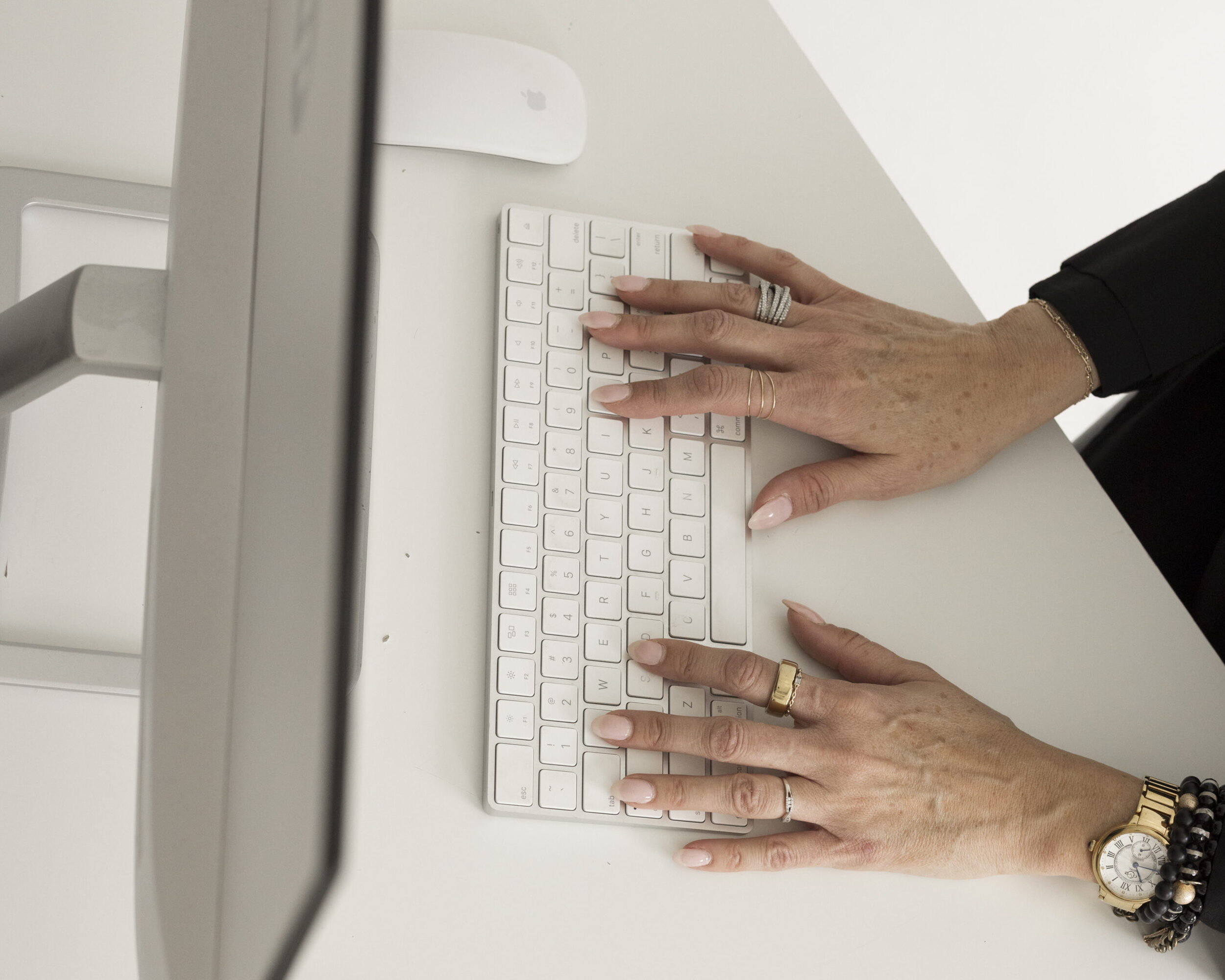 person hands typing on a computer keyboard